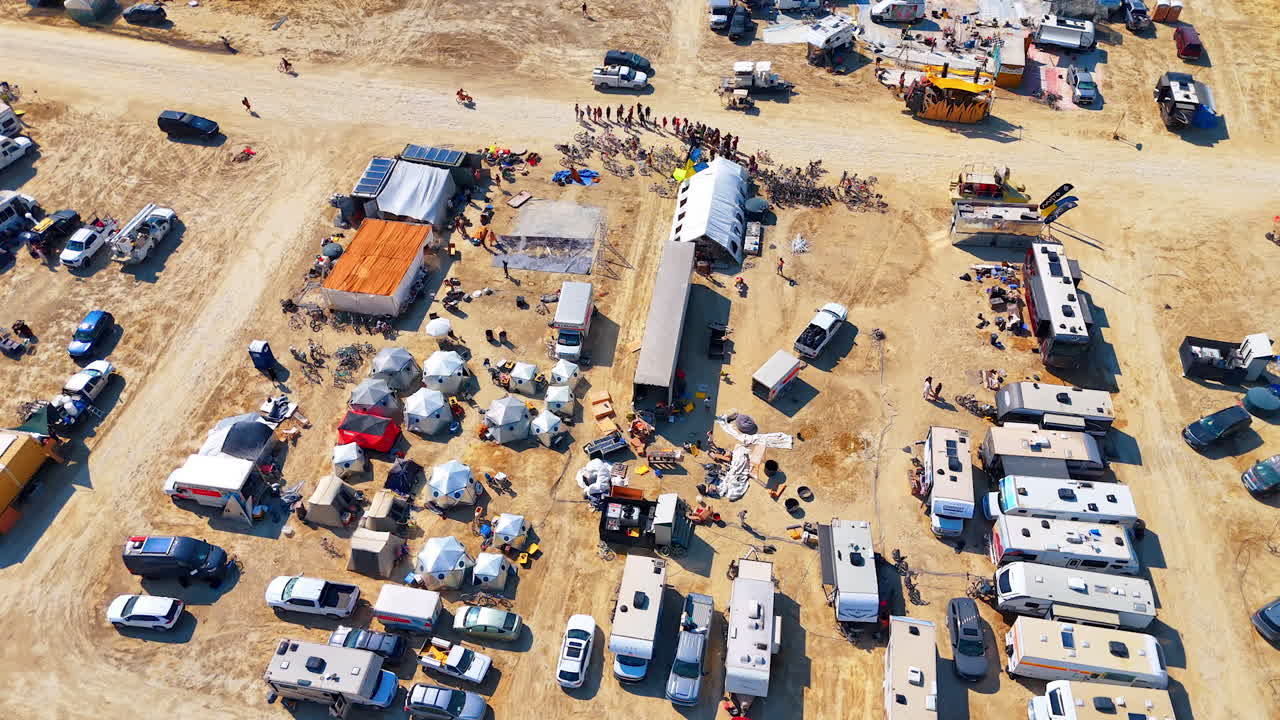 Nevada, USA, 14 August 2025: Aerial view of Burning Man campsite with tents and RVs in Nevada desert.. Drone view shows a dense campsite with tents and vehicles