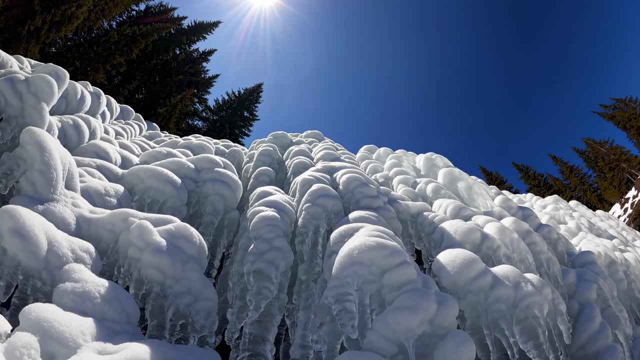 Frozen Waterfall with Icicles and Snow