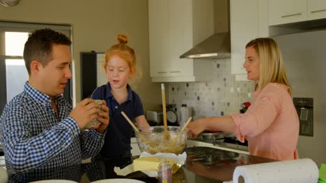 family having fun in kitchen 4k
