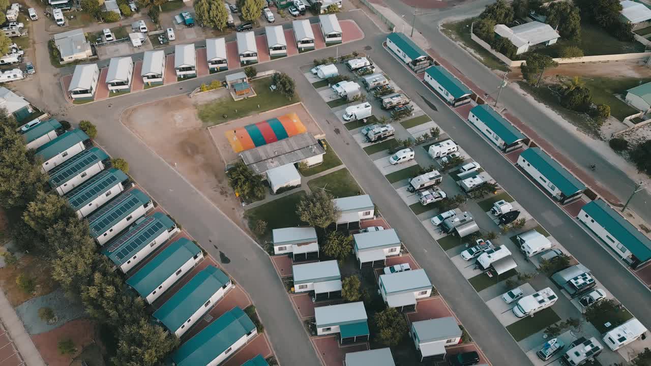 Aerial footage advancing towards and panning downwards to the Jurien Bay Tourist Park in Perth, Western Australia