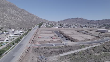 in a swift drone flight, we traverse over a cluster of freshly flattened lots, primed and awaiting the beginning of home construction