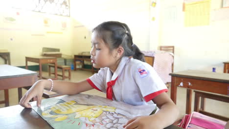 girl reading in a classroom