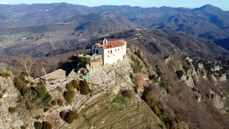 drone shot sanctuary of bellmunt on mountain in osona in spain