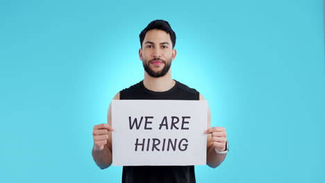 Recruitment,-portrait-and-man-in-studio-with-sign