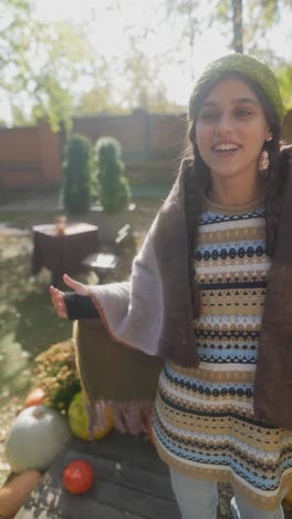 woman enjoying an autumn day in the garden