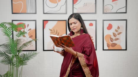 Indian-woman-reading-book-with-coffee
