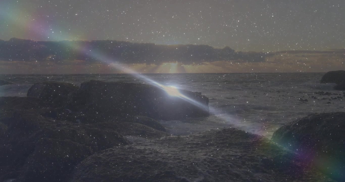 Swell swelling waves crashing rock outcrop spraying water while lens flare drifting creating loop