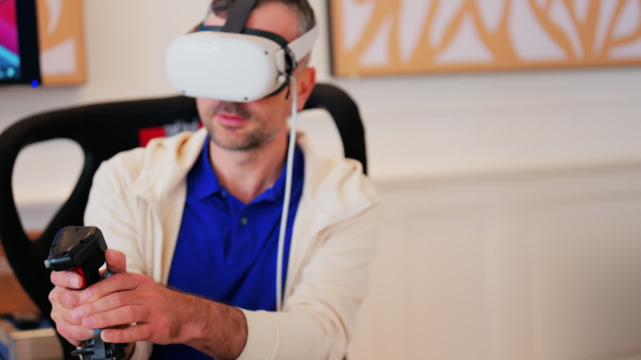 Man wearing a Virtual Reality headset, playing games