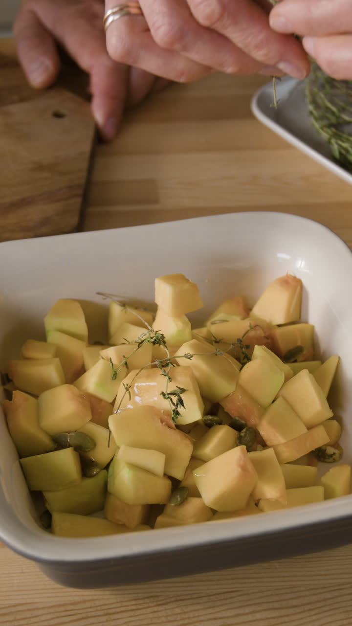 Preparing butternut squash with thyme