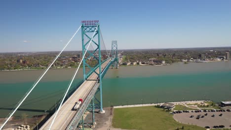 Ambassador-Bridge-connecting-Detroit,-Michigan-in-the-United-States-of-America-and-Windsor,-Ontario-in-Canada-drone-video-moving-sideways