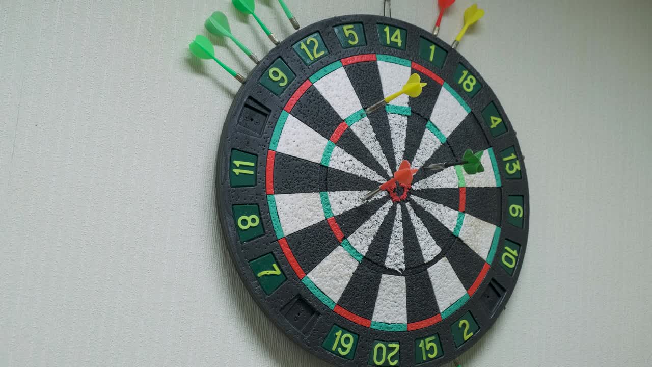 Colorful arrows hit the dartboard as a symbol of success and failure.