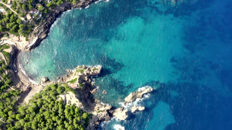 AERIAL:-Over-Beautiful-Coast-Line-of-Tropical-Island-Mallorca,-Spain-with-ocean-and-Blue-water-in-Summer,Daylight-Vacation,-Travel,-Sunny,-Waves
