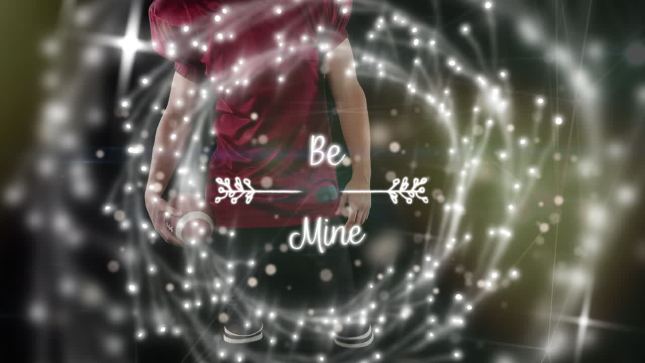 공을 들고 있는 백인 남성 아메리칸  ⁇ 볼 선수 위의 반점과 함께 광산 텍스트의 애니메이션