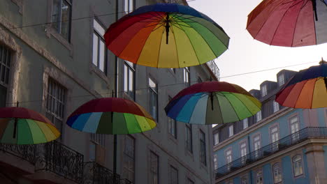 rua cor de rosa decorated with colorful umbrellas in lisbon, portugal