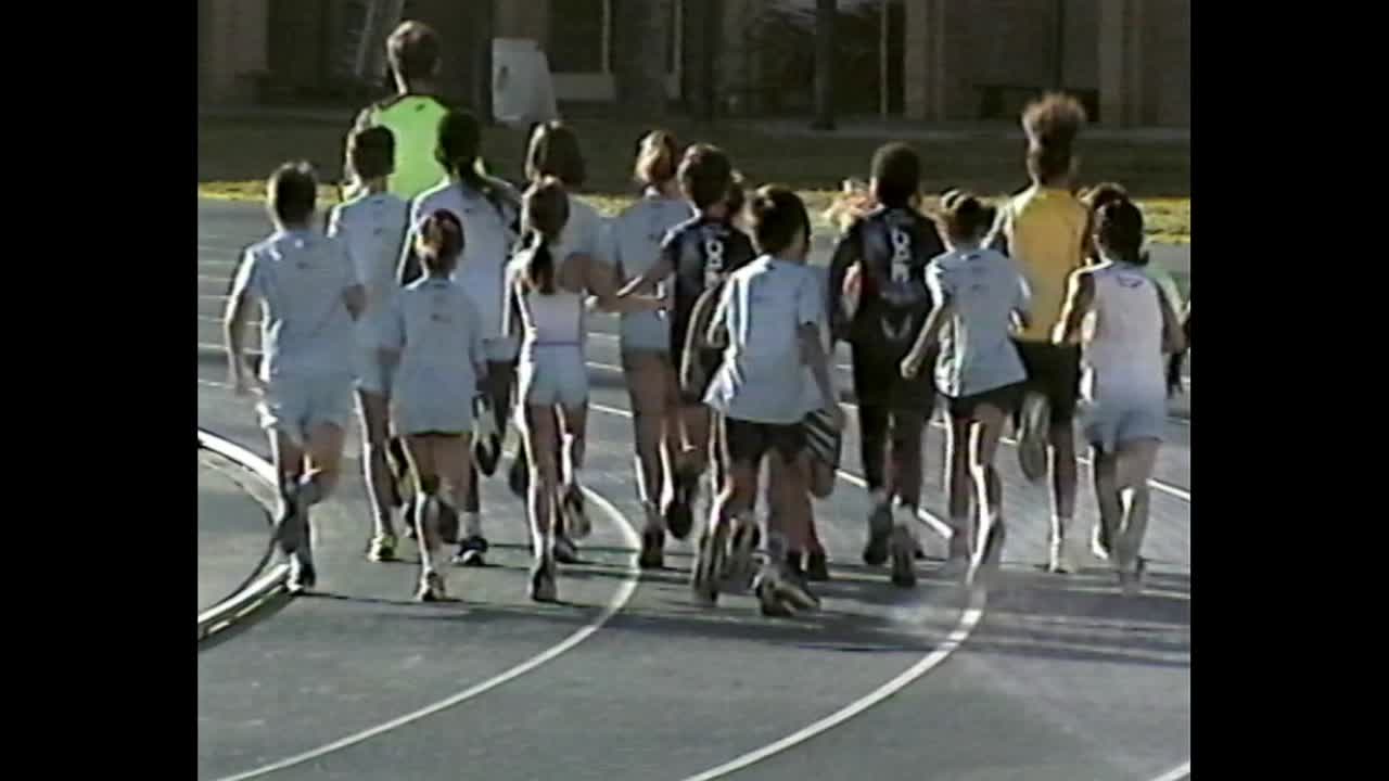 Group of children running on a track