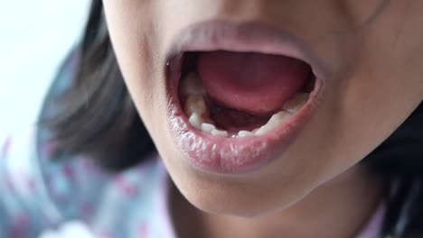 close up of child screaming at home , slow motion