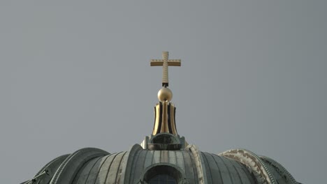 cross on the berliner dom on a sunny day