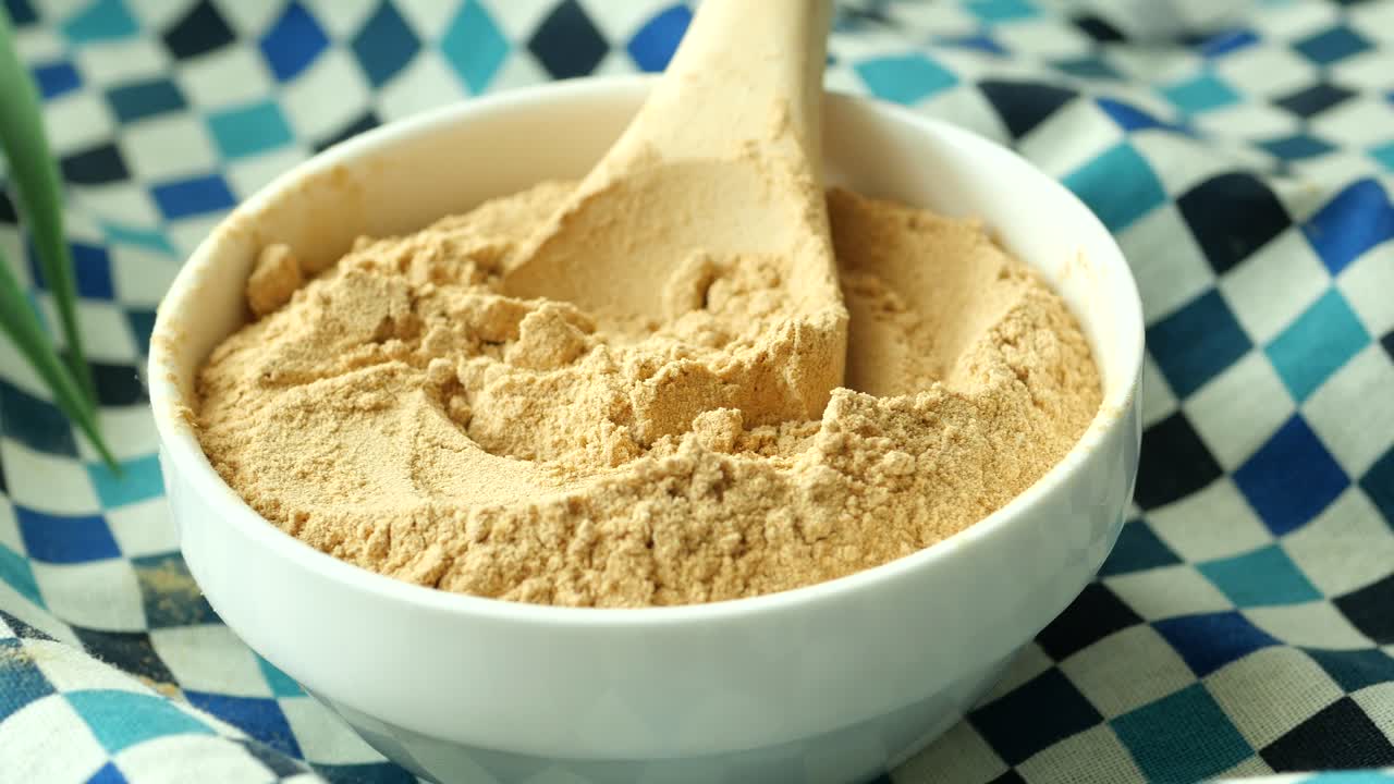 Bowl of Flour with Wooden Spoon