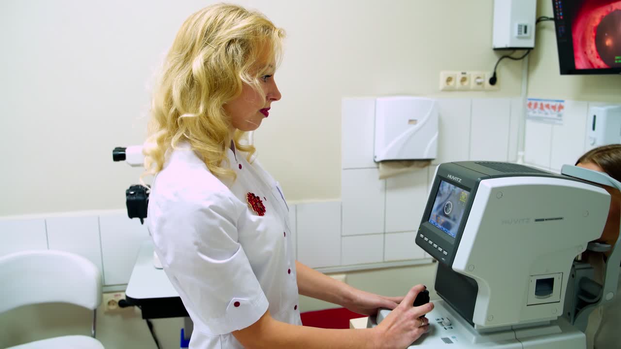 Oculist checking up woman's eyes in modern clinic. Profesional ophthalmologist use medical machine to make a diagnostic of patient's eye.