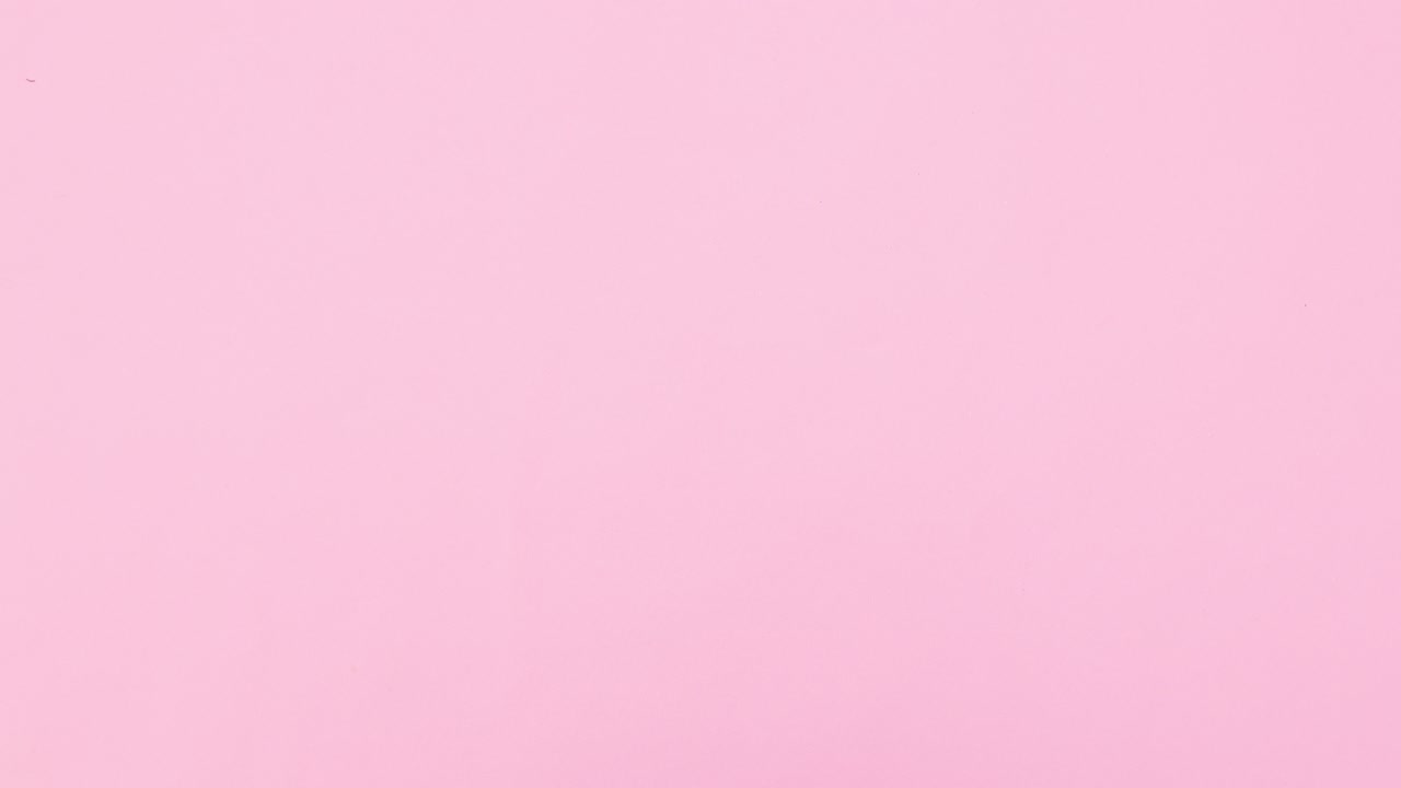 Pine branches decoration with silver and pink ornaments and snowflake appear on right side of pastel pink theme. Stop motion