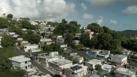 aerial drone shot of fajardo puerto rico neighborhood mid day ocean reveal