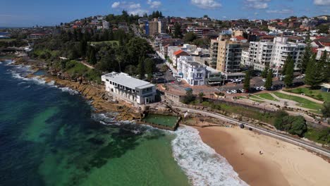 coogee surf life saving club and ross jones rockpool in sydney, nsw, australia - drone shot