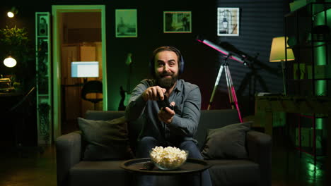 ecstatic man gaming at home yelling from joy after achieving victory