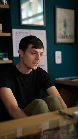 man sitting in a store