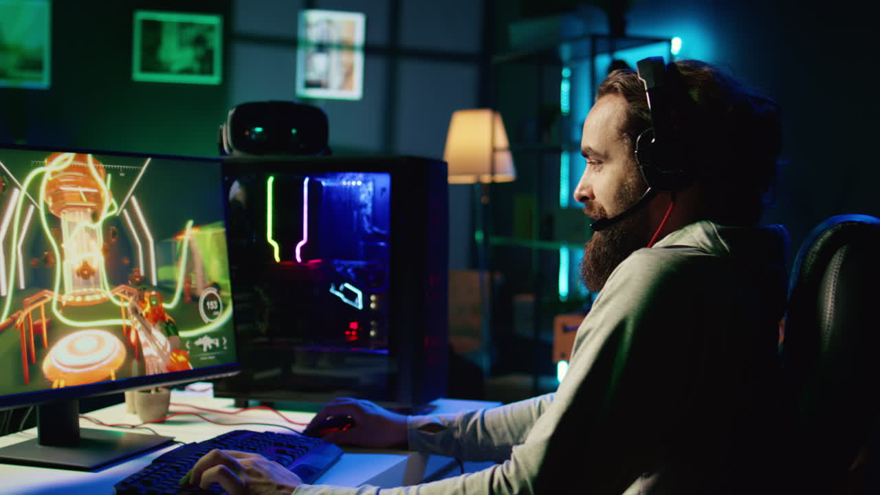 Man playing FPS videogame with friends, communicating through headphones mic