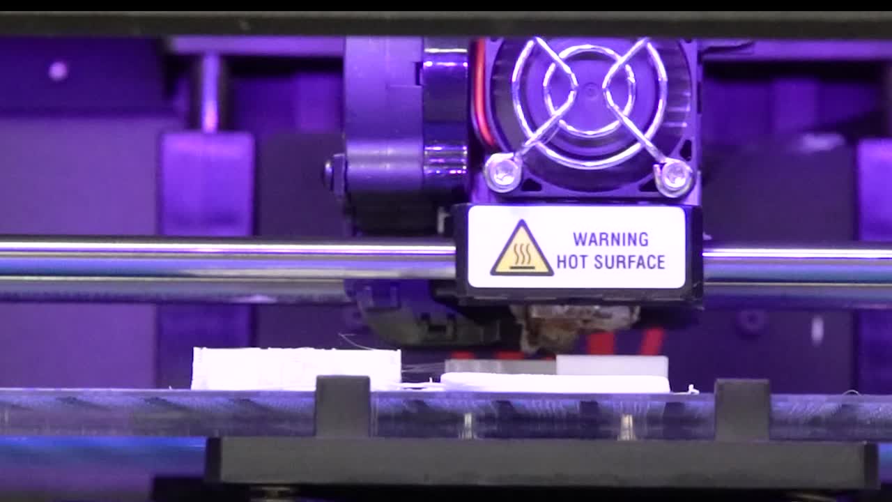 front view of a 3d printer making an industrial concept model