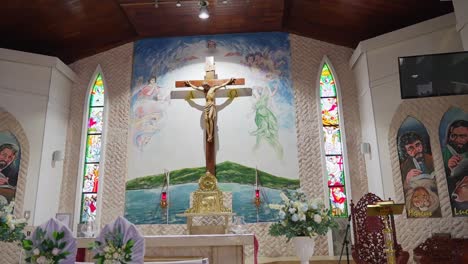 pan shot of wedding decorations of the church's altar