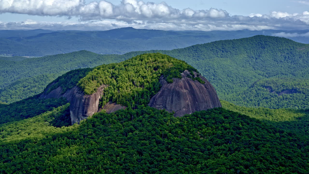 A single mountain dominates the frame, set apart from the range — captured from above