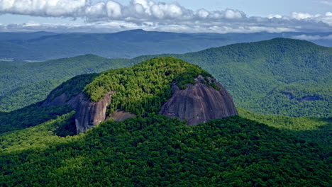 a single mountain dominates the frame, set apart from the range — captured from above