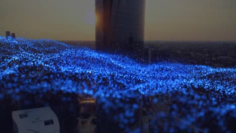 animation of blue spots over cityscape