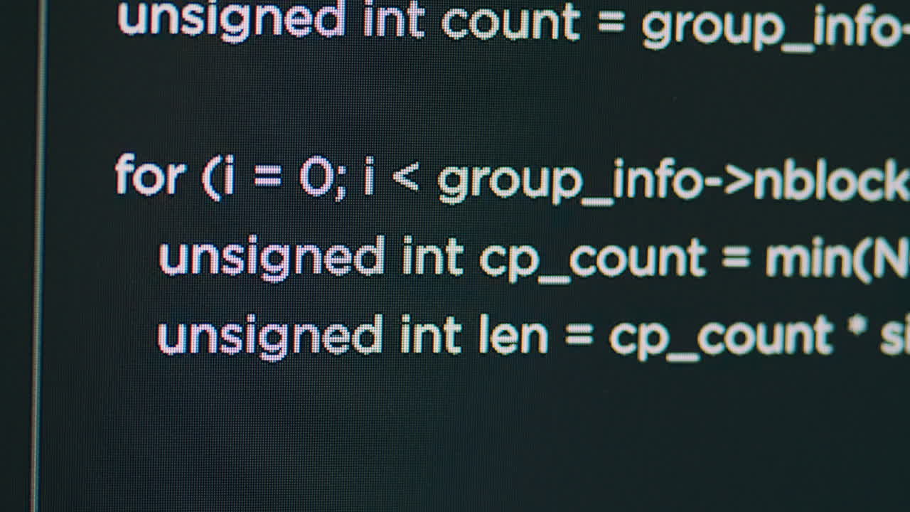 Monitor display of system engineer typing source code on terminal window