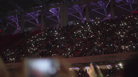 a beautiful view of crowded tribunes on a music concert