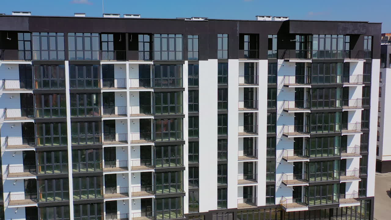 New high-rise residential building in city suburb. New apartment houses. Video of modern buildings.