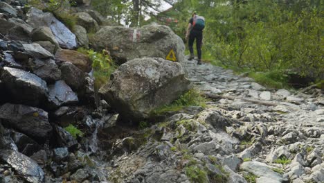 Backpacker-Hiking-On-Rocky-Trail-Of-Alpe-Ventina-In-Sondrio,-Italy