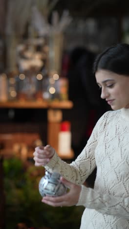 teenager browsing christmas ornaments