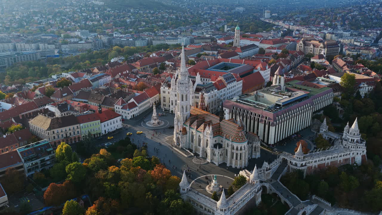 Detailed aerial of the colorful-tiled Matthias Church and white turrets of Fisherman’s Bastion in Buda