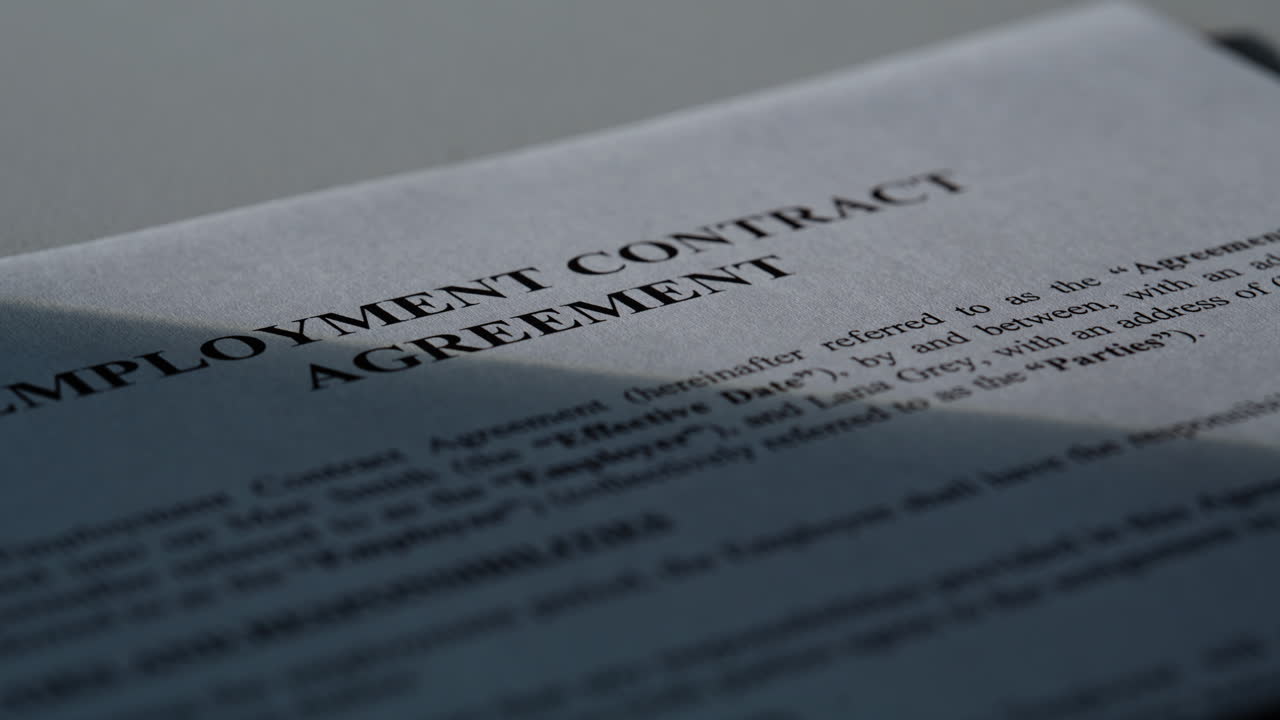 Dolly shot legal file with visible text. Formal agreement structured language