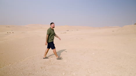 tourist sightseeing giza plateau site of the fourth dynasty giza pyramid complex in egypt. aerial shot