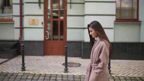 woman walking on city street