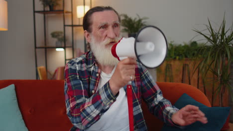 Senior-old-grandfather-man-talking-with-megaphone,-proclaiming-news,-loudly-announcing-advertisement