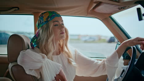 woman driving a vintage car