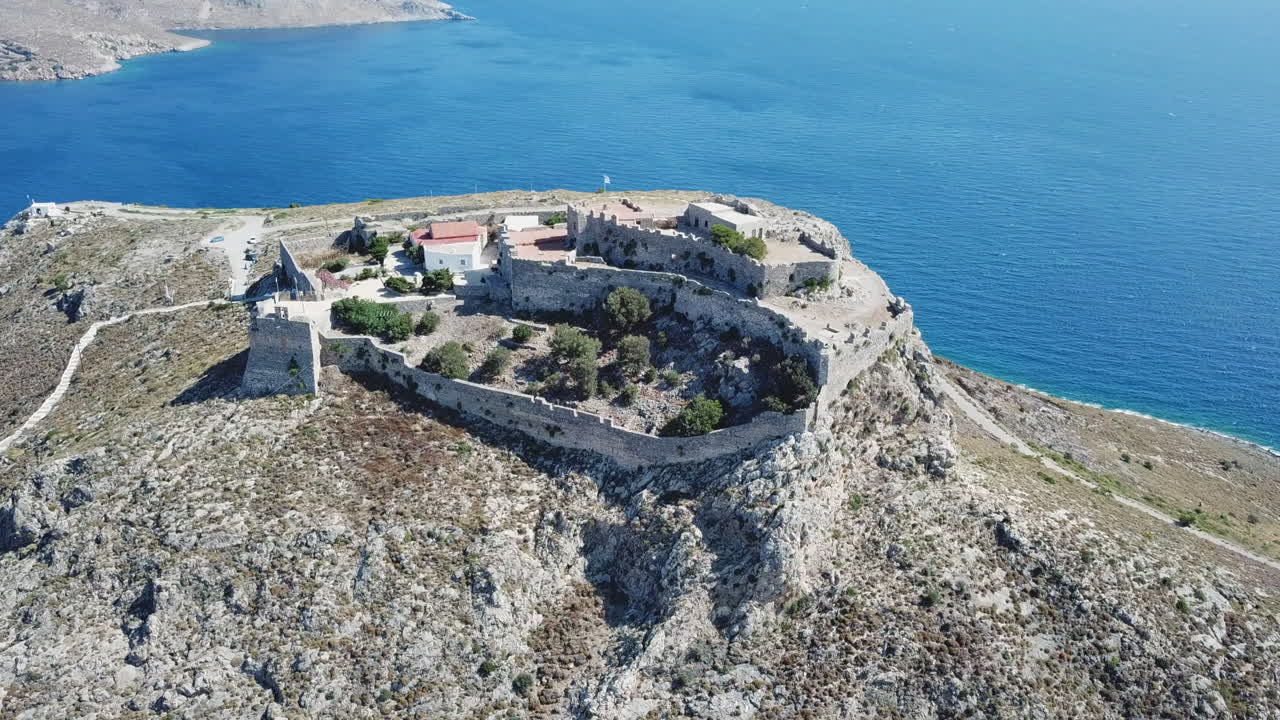 Aerial View of a Castle on a Cliff overlooking the Sea
