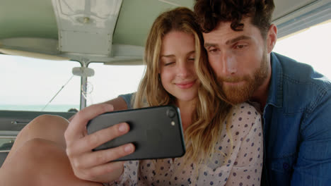 Young-couple-taking-selfie-with-mobile-phone-4k