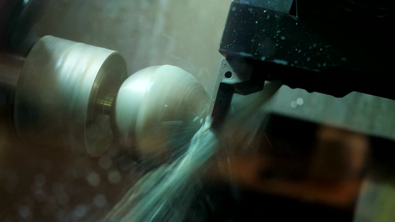 close view milling machine operates with white round detail