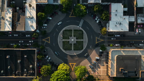 Aerial-time-lapse-looking-down-at-roundabout-in-Franklin,-Tennessee-at-sunset