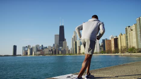 african american male doing running and stretching training